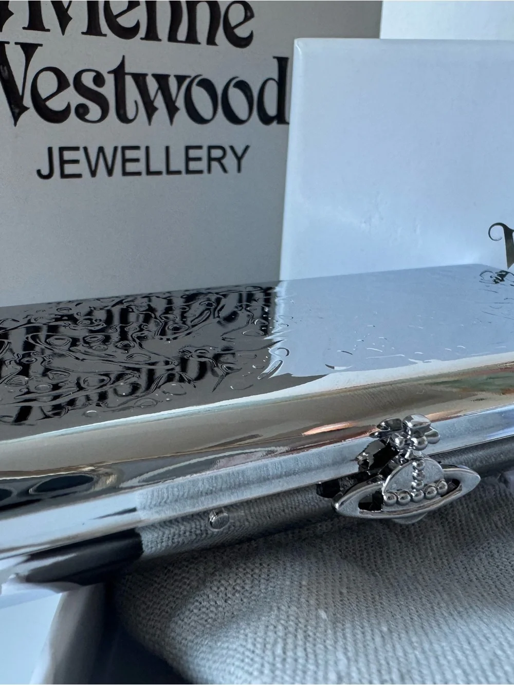 Vivienne Westwood Metallic Silver Orb Clutch Phone Case
